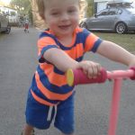 office mum photo of son on scooter