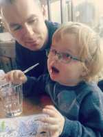 The soon to be broken glass, the culprit, and the listening husband